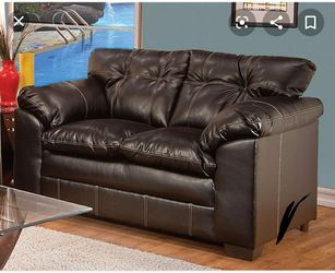 Black leather loveseat plush seats