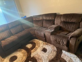 Brown sectional couch &Rug both in good Condition