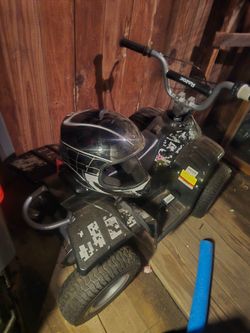 Electric Kids ATV with Helmet Great Condition
