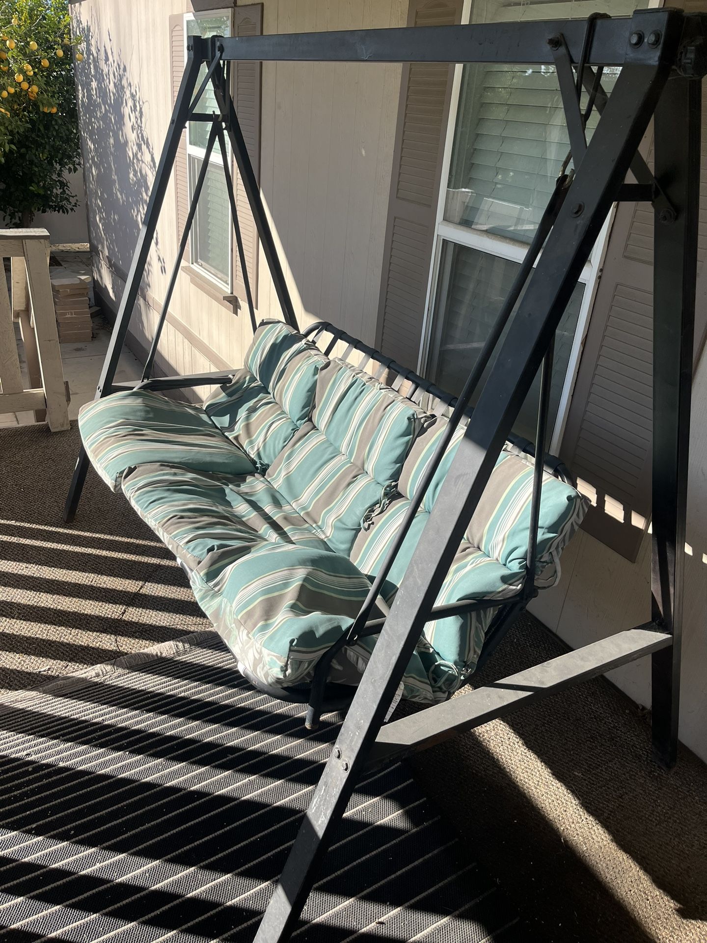 Porch swing with cushions