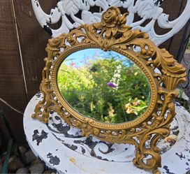 Antique cast metal ornate mirror