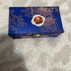 Traditional Chinese iron balls (Baoding balls) in original decorative case.