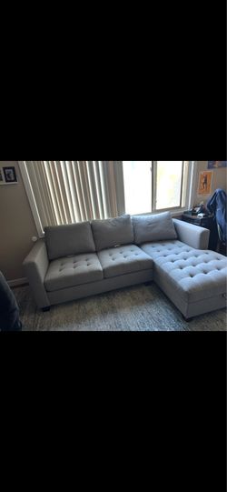 Grey sectional sofa with storage chaise
