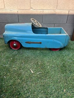 Vintage 60s Blue rocket pedal car