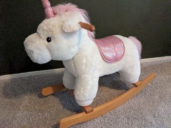 Riding unicorn plush