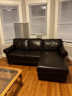 Dark brown leather sectional sofa with chaise