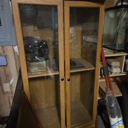 Small, glass front cabinet.