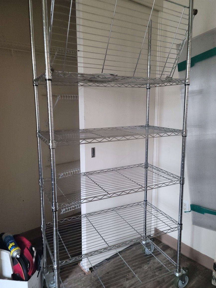 Metal Chrome Shelf Tier With Wheels.  $85