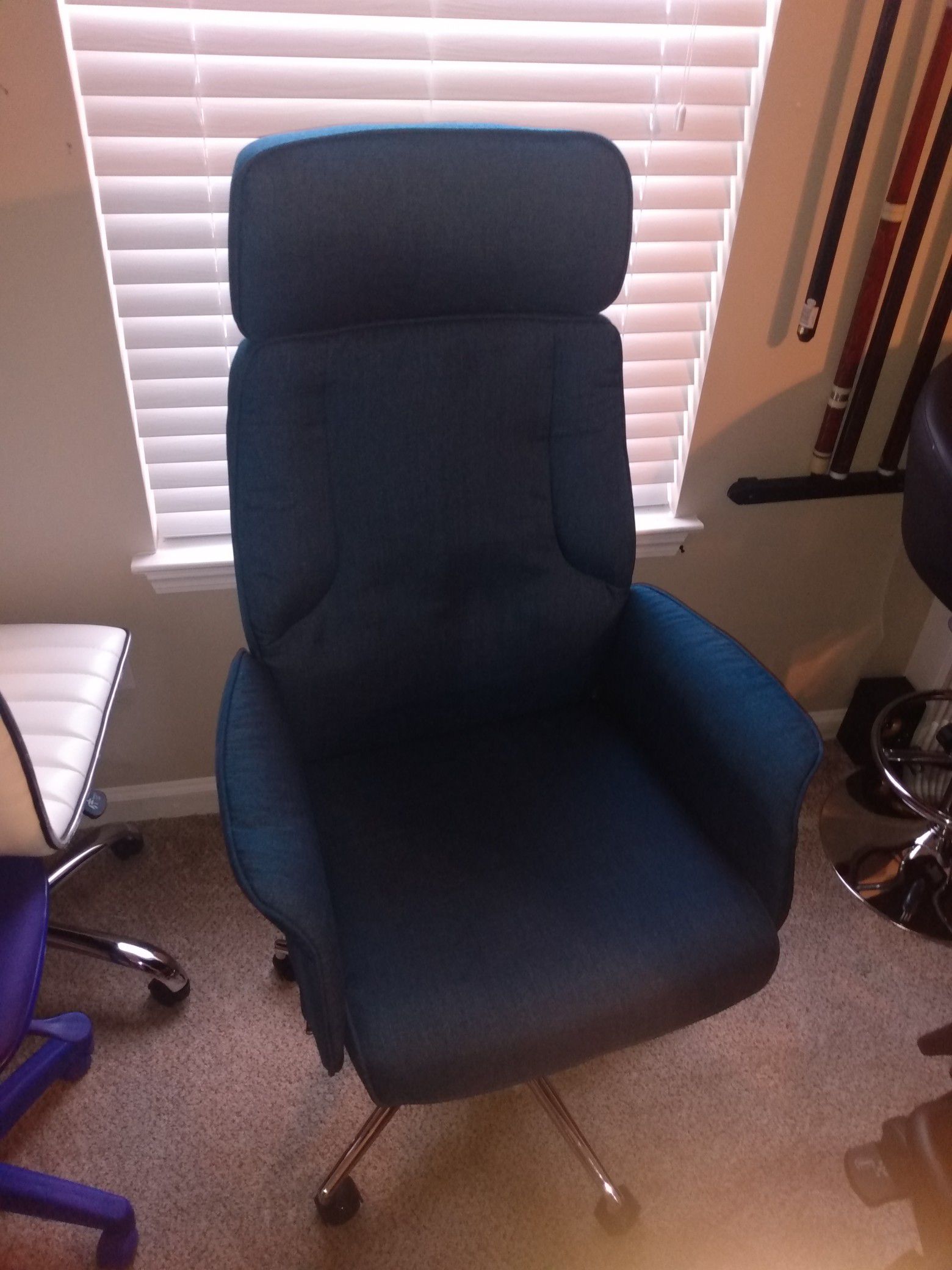 Brand new blue office chair with head rest