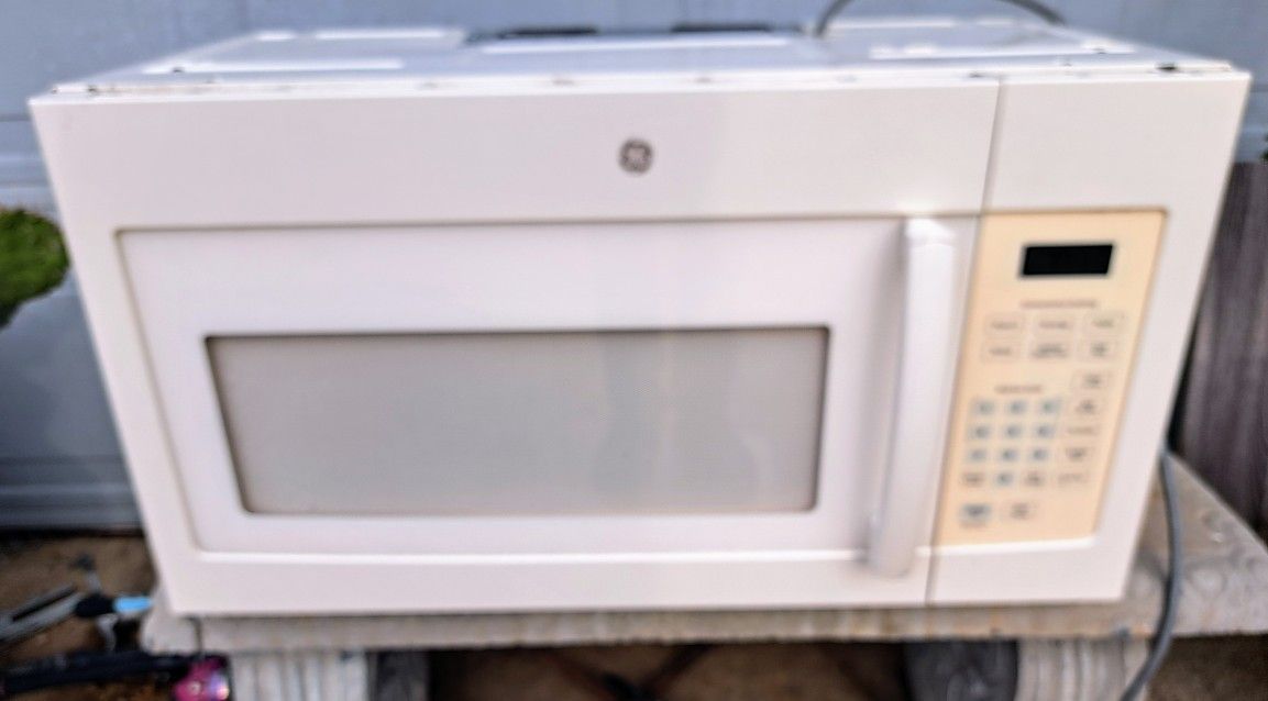 Cream Color Over The Stove Microwave 