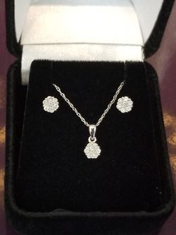 White gold diamond earrings with matching diamond necklace