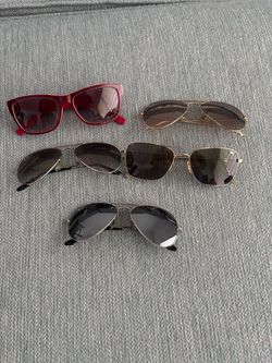 Lot of Lacoste and Ray Ban sunglasses