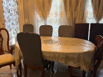 Table with six chairs and two extra pieces