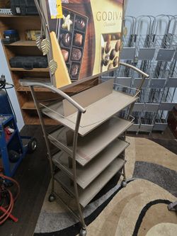 Double sided swiveling display rack