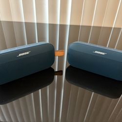 A Pair Of Bose Sound Link Flex Second Generation Bluetooth Speakers