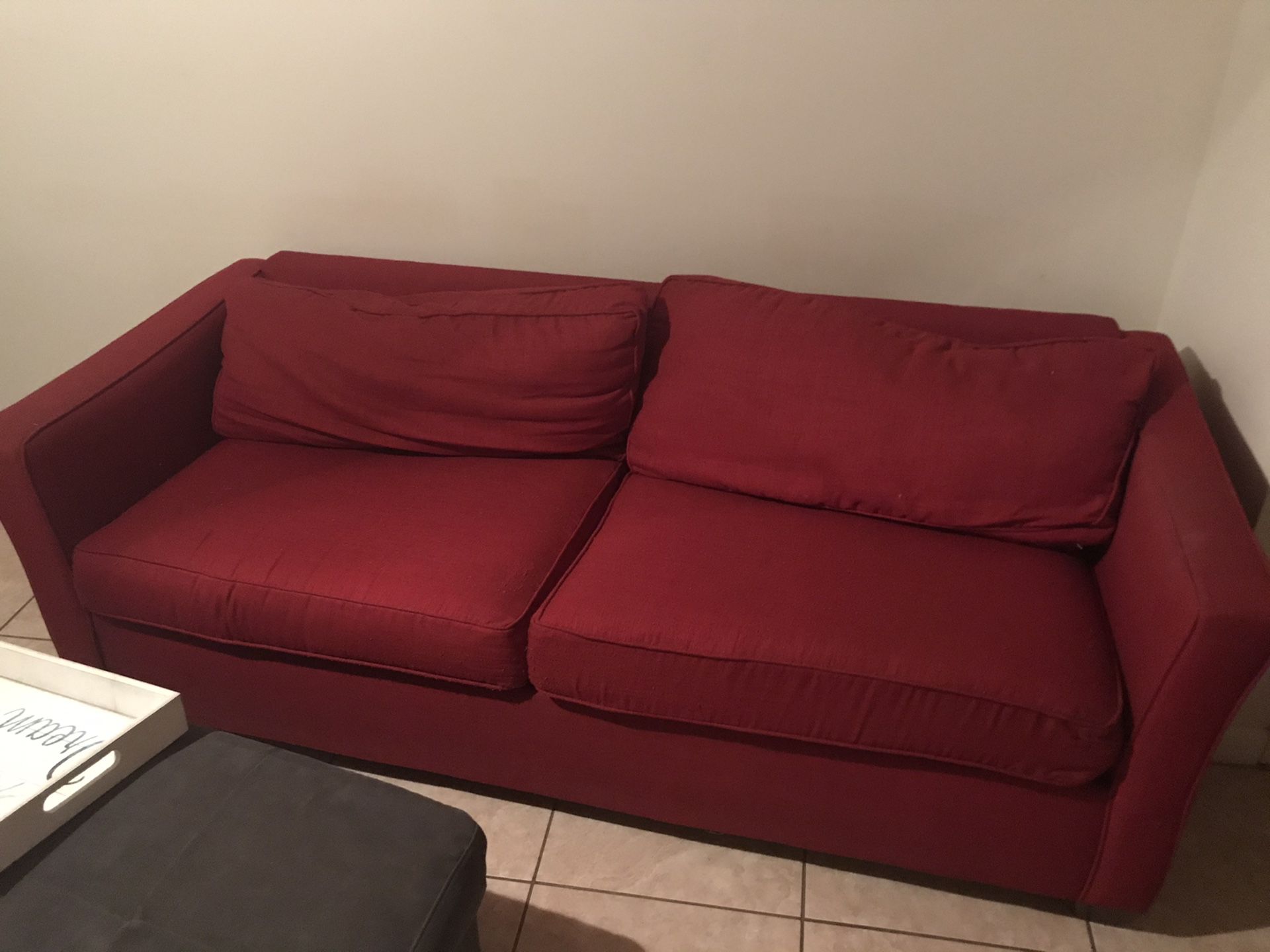 Free red couch - must pickup ( will need truck and another person )
