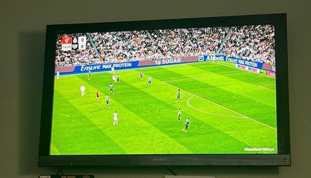 52 in tv , with wall mount and Apple TV device