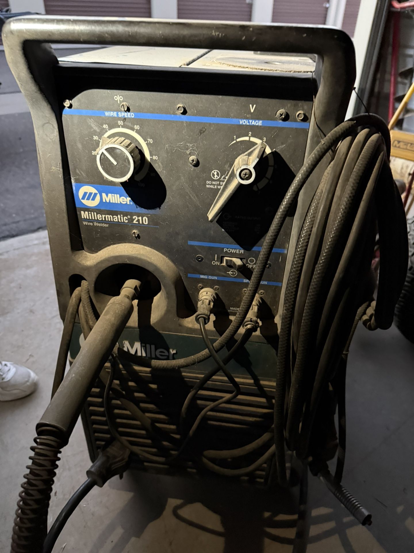 Millermatic 210 MIG welder with wheel