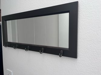 Mirror with hooks