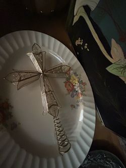 vintage capiz shell and wire filigree cross, which appears to be a Cross Tree Topper or decorative ornament featuring a spiral metal base. [1] (https: