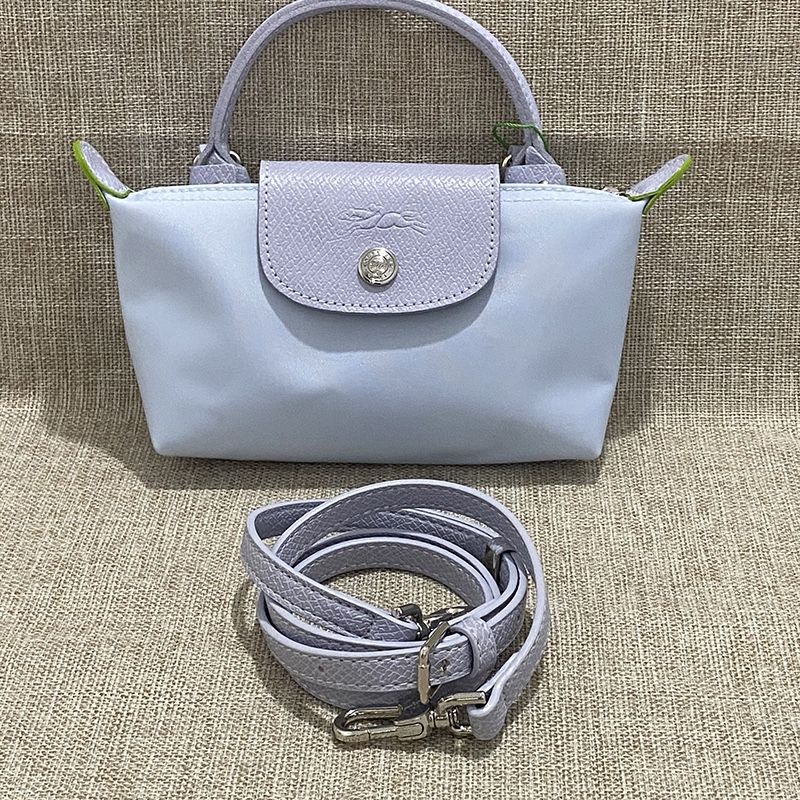 Longchamp's light blue mini dumpling bag is versatile. 