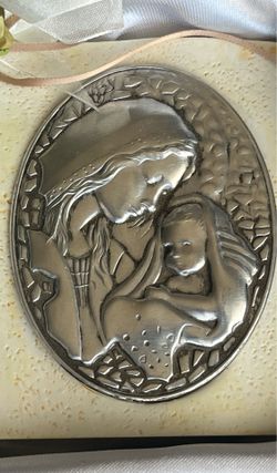Decorative Pewter plaque with the Virgin Mary and child.