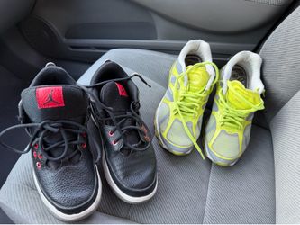 2 pair of used Nike sneakers