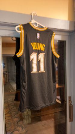 Atlanta Hawks Trae Young #11 Nike Swingman City Edition "MLK" jersey, size 50 (Large). Black with gold and white trim, honoring Dr. Martin Luther King