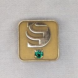 Vintage OC Tanner gold lapeil pin