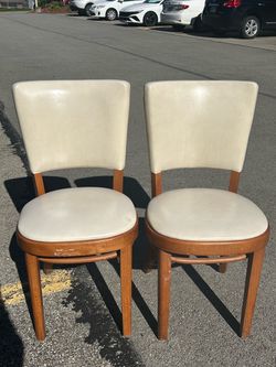 Pair of wooden chairs with leather material