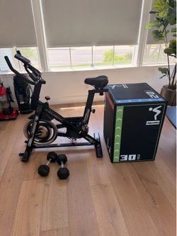 Exercise bike, 20lb dumbbells, and jump block