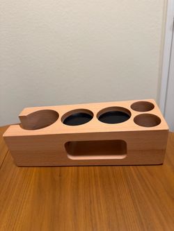 Wooden organizer for espresso tools and accessories. Designed to hold a portafilter, tamper, and other coffee-making tools.  Had it for 1 month, doesn